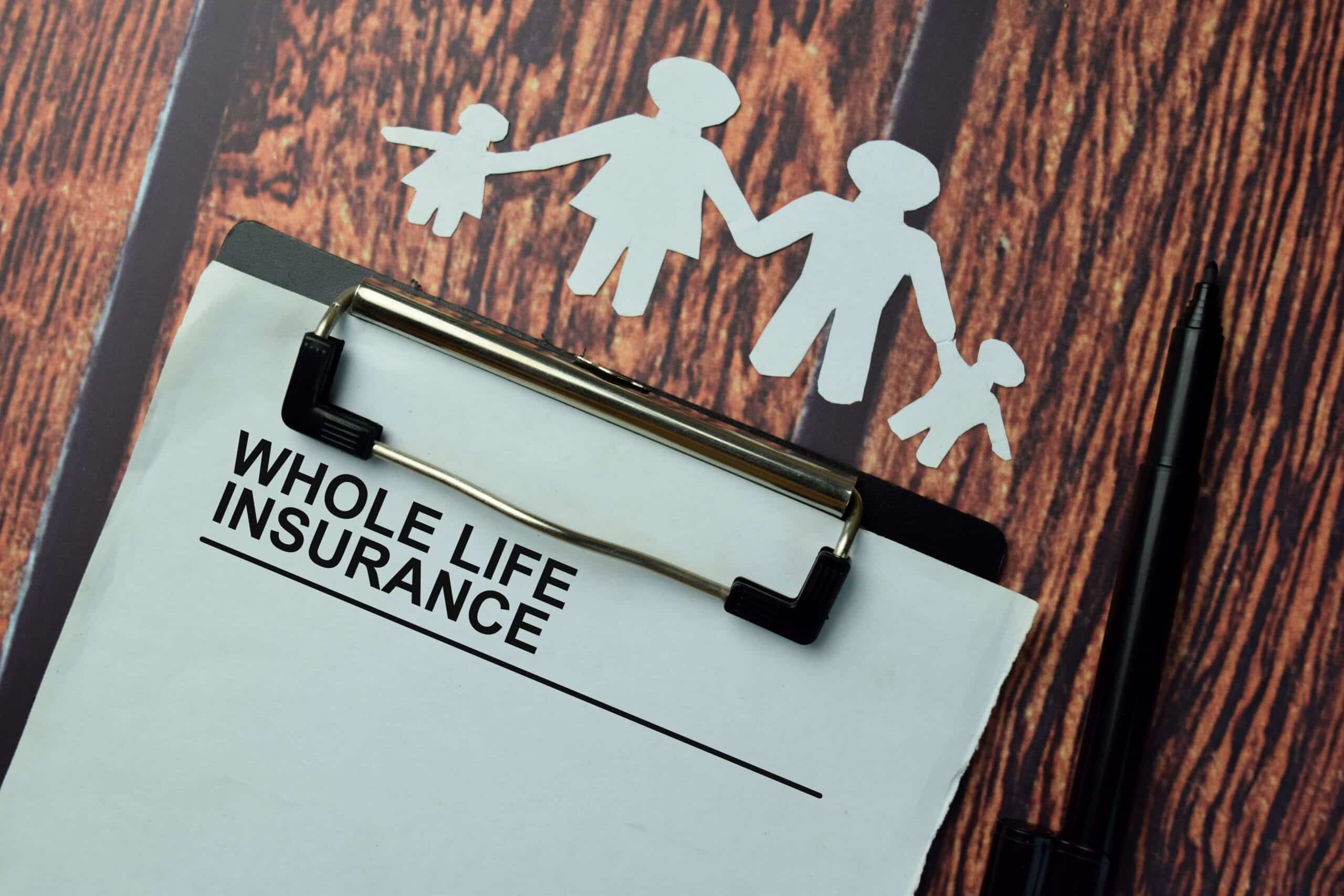Clipboard that has a paper with whole life insurance on it