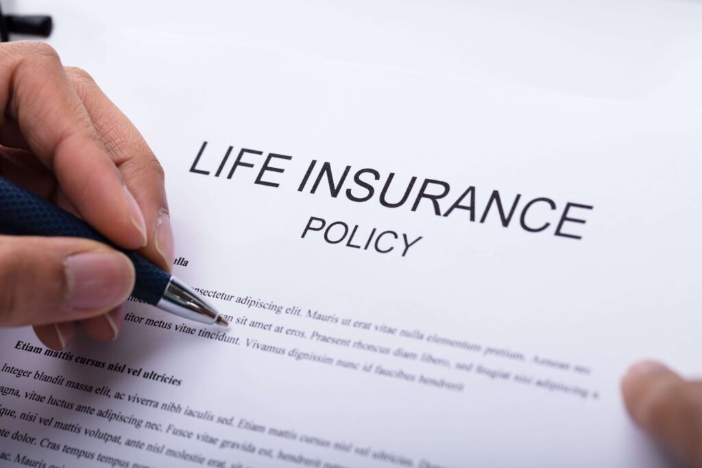 Person signing a life insurance policy