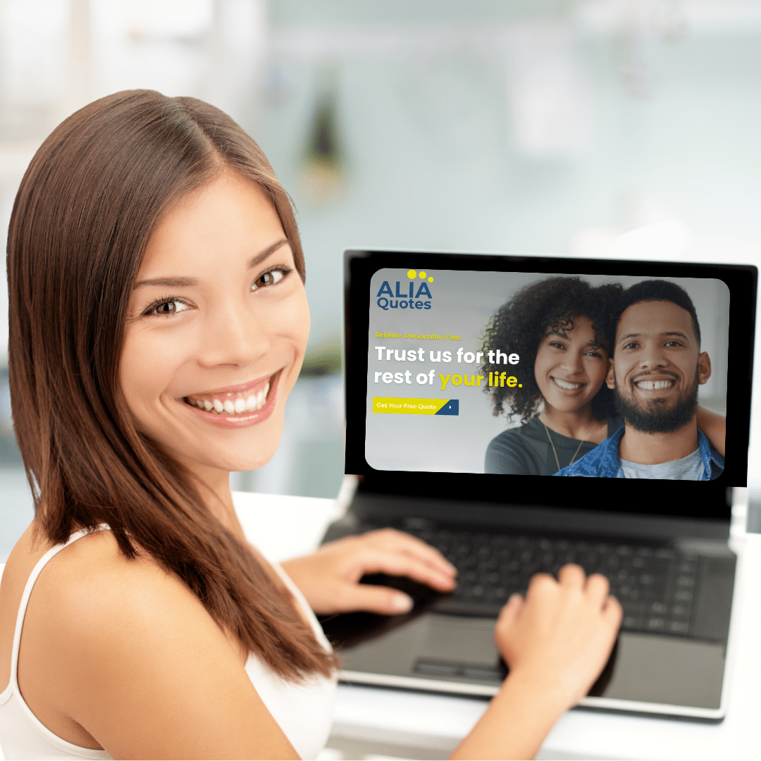 Young woman smiling and using ALIA website on a laptop