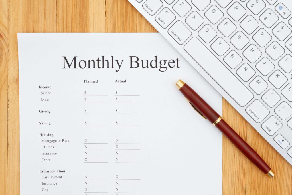 Piece of paper outlining a person's monthly budget.