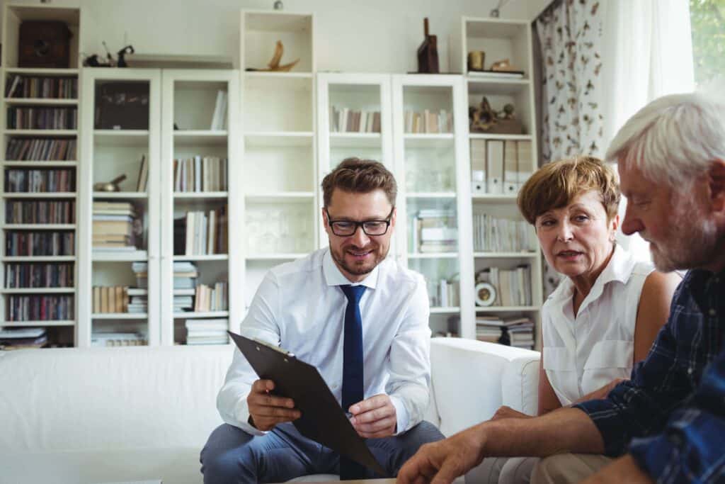 Elderly couple planning their retirement with a financial planner